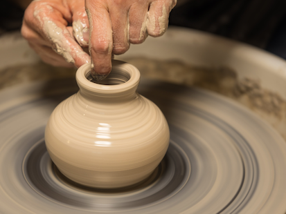 Hands making clay Vase