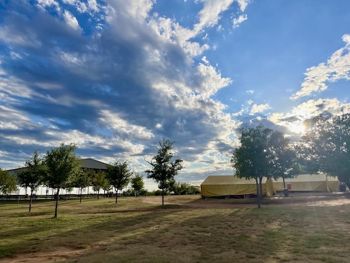 White River Youth Camp campgrounds with trees and a basketball court in the background